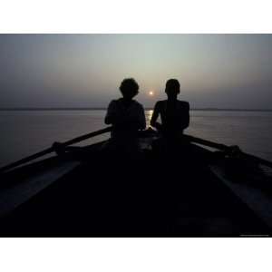  Silhouettes of Boatmen Rowing at Dawn on the Holy Ganges 