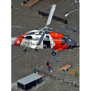  Coast Guard Rescues One from Roof Top of Home, Floodwaters 