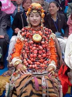 Girl from Tibet wearing a HUGE amount of real coral.