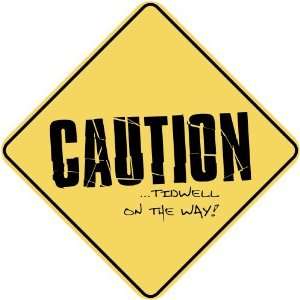   CAUTION  TIDWELL ON THE WAY  CROSSING SIGN