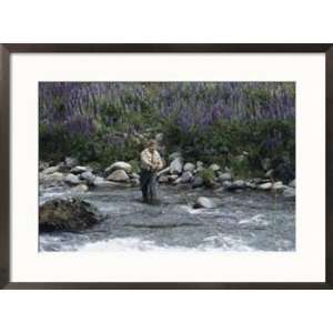 fly fishing guide casts his line near Coyhaique, Chile Framed Art 