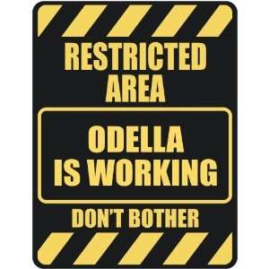   RESTRICTED AREA ODELLA IS WORKING  PARKING SIGN