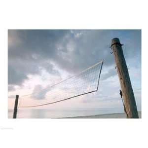  Volleyball net on the beach Poster (24.00 x 18.00)