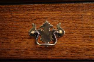 These antiqued solid brass pulls form a beautiful contrast to the oak.