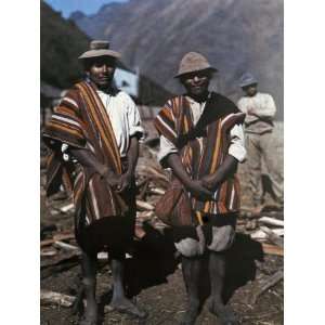  Two Men Pose with their Brilliant Ponchos in the Andean 